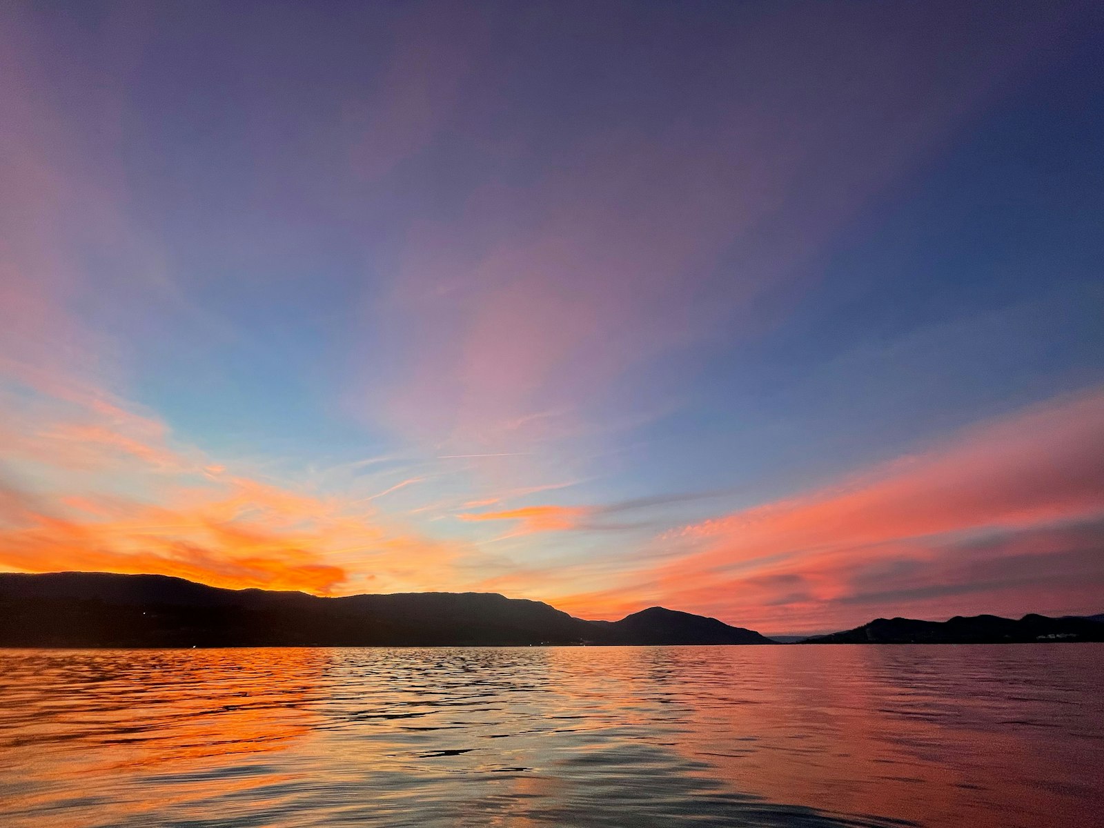 Orange and pink sunset over the lake