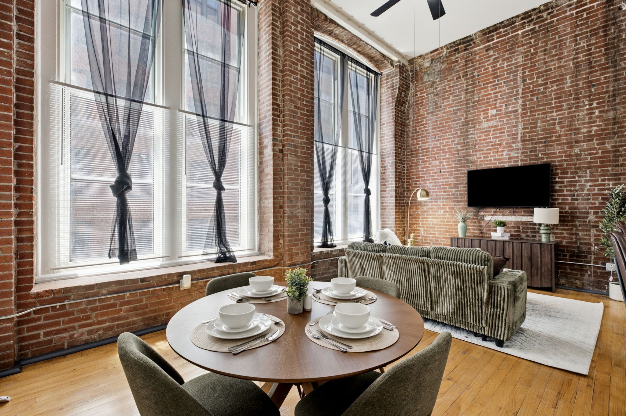 Cozy living room seating with brick accent wall